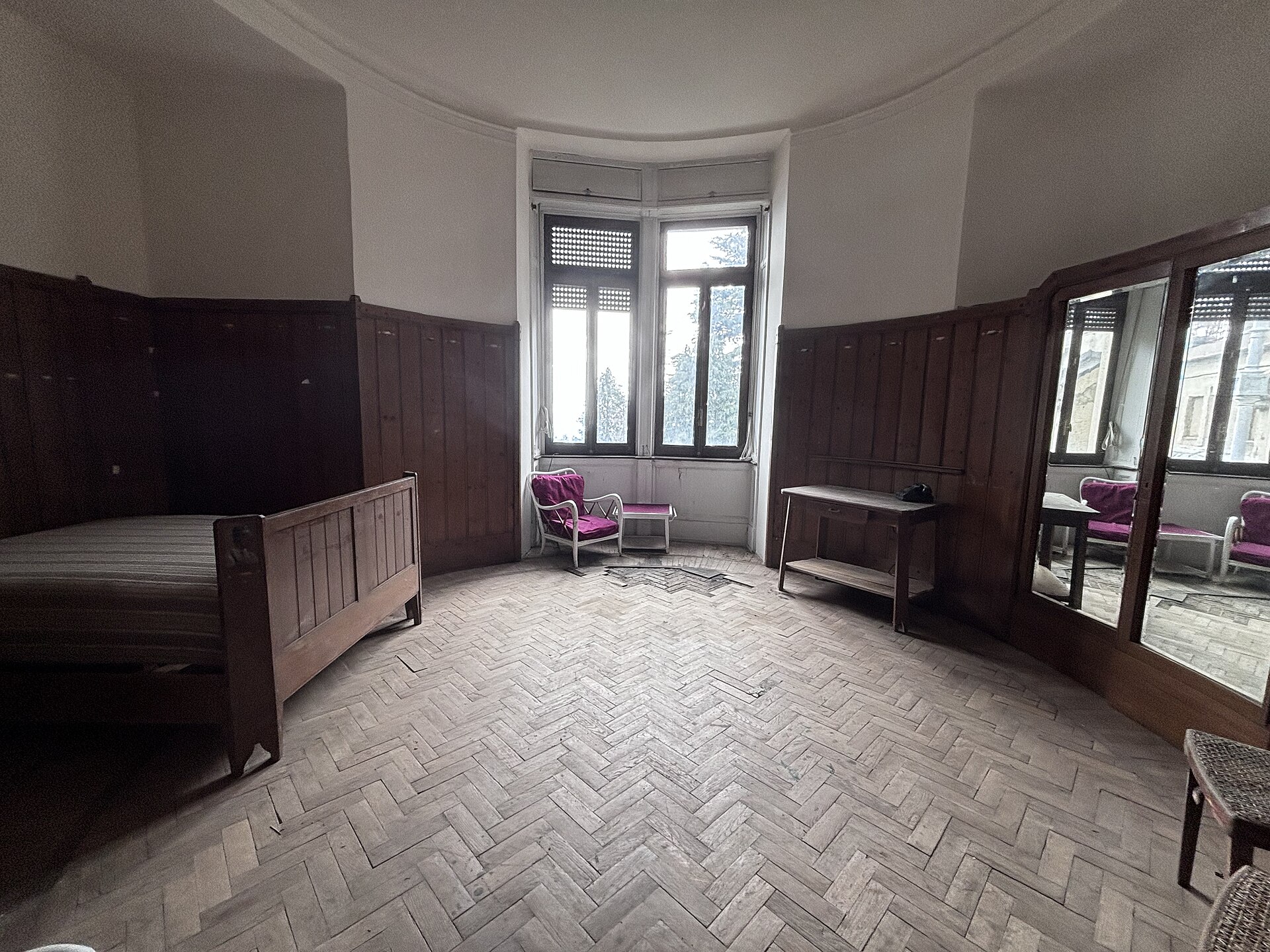 A calm hotel bedroom with a made bed